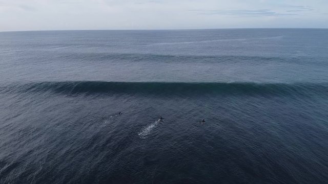 Surfers in Ribeira de Ilhas beach in Ericeira Portugal