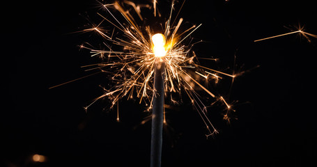 Obraz premium Firework festive sparkler burning on black background