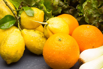 Still life of Lemons and oranges and other vegetables