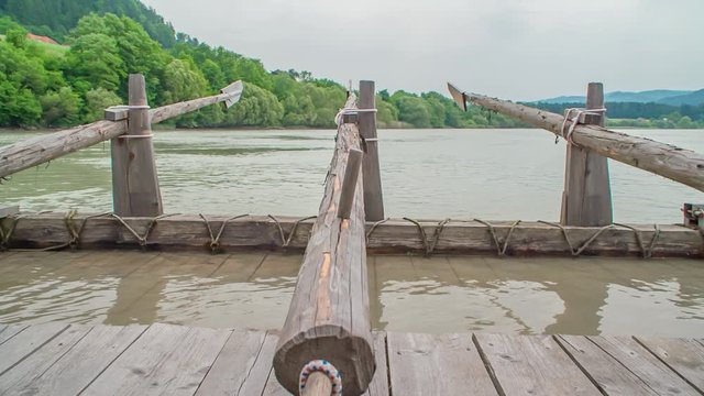 A set of wooden oars in a traditional timber rafting wharf at a Slovenian event