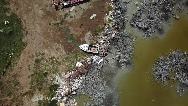 Birds Eye Aerial View Of Boat Wreck And Waste On Shore Of Puerto Rico, Aftermath Of Hurricane Natural Disaster