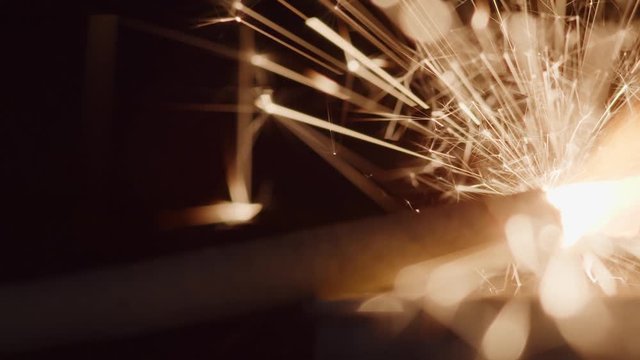 Dynamite fuse burns and sparks as it inches closer to the explosion - concept: mission impossible, difficult task, anticipation, stress, challenge, ignite, sudden idea, expectation