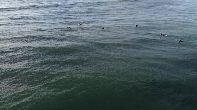 Surfers in Ribeira de Ilhas beach in Ericeira Portugal