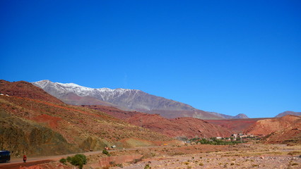 Bright landscape of Morocco, breathtaking curves of mountains, stunning combination of hills & farm land,inadvertent distribution of houses & huts, raw impression of pure nature.