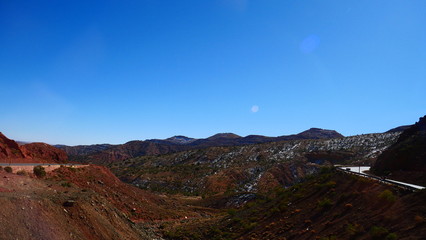Bright landscape of Morocco, breathtaking curves of mountains, stunning combination of hills & farm land,inadvertent distribution of houses & huts, raw impression of pure nature.