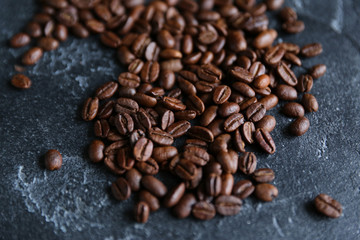 Coffee beans on a dark background. Background image, copy space