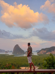 young men on vacation in Thailand visiting the bay of Phannga famous for its James Bond Island and...