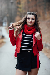 Outdoors portrait of beautiful young brunette girl. A beautiful young woman enjoy nature smiling.  Pretty woman on nature background