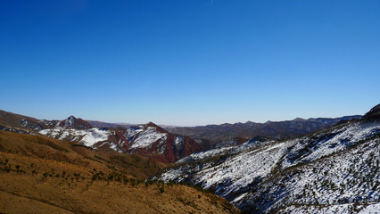 Bright landscape of Morocco, breathtaking curves of mountains, stunning combination of hills & farm land,inadvertent distribution of houses & huts, raw impression of pure nature.