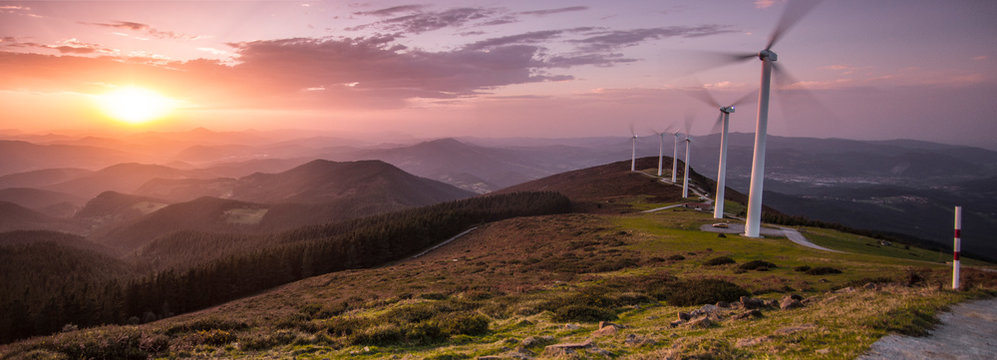 eolic generators on the mountains at sunset