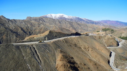 Bright landscape of Morocco, breathtaking curves of mountains, stunning combination of hills & farm land,inadvertent distribution of houses & huts, raw impression of pure nature.
