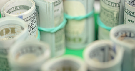 money twisted into rolls for a hundred dollars