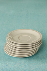stack of empty white plates