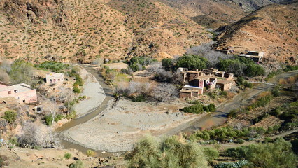 Bright landscape of Morocco, breathtaking curves of mountains, stunning combination of hills & farm land,inadvertent distribution of houses & huts, raw impression of pure nature.