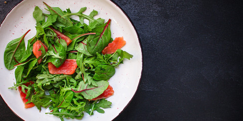 healthy salad leaves mix, salmon or tuna (delicious snack) menu concept. food background. top view. copy space