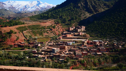 Bright landscape of Morocco, breathtaking curves of mountains, stunning combination of hills & farm land,inadvertent distribution of houses & huts, raw impression of pure nature.