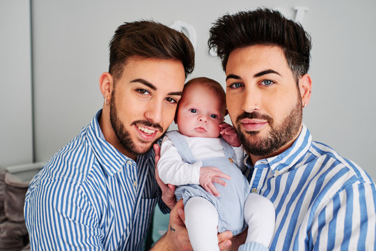 A Gay Couple With Their Son - Gay Parents Concept