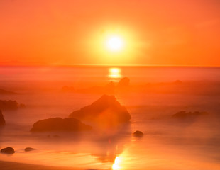 red sunset on a wild beach