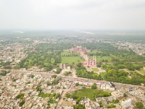 Aerial view of Tomb of Akbar The Great Area surrounded by houses and trees, Sikandra, Agra, Uttar Pradesh, India