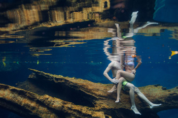 Couple enjoying an underwater landscape