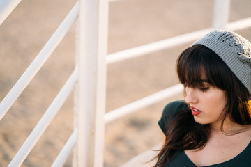 Portrait of a Beautiful young woman at beach during sunset