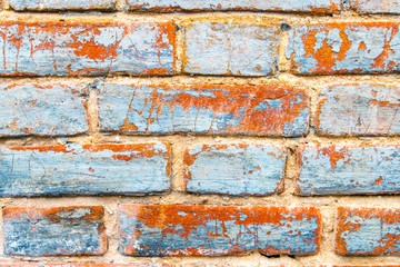 Red and blue vintage wall with damaged brick. Vibrant abstract wallpaper, banner.