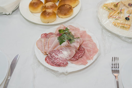 Catering for a banquet. Delivery of servings of food in packaging directly to the table.