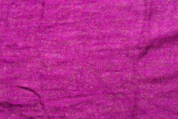 Fuchsia color wrinkled fabric texture. Closeup