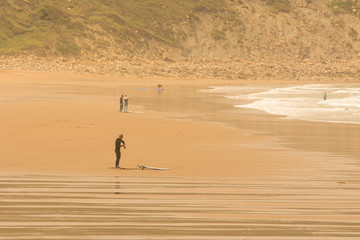 Fototapeta na wymiar Surfer in sopelana in basque coast, Spain