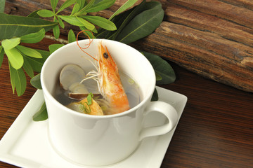 The portrait of food Seafood soup on the white cup