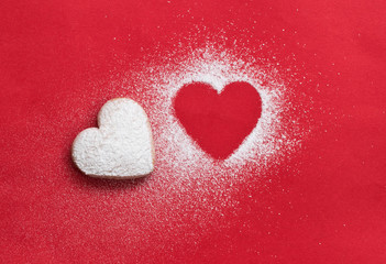 Fototapeta premium heart cookie and heart shaped candy on red background