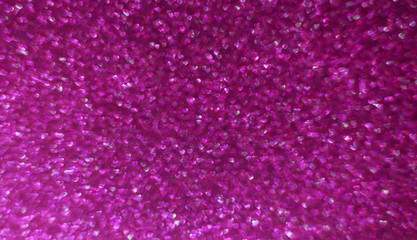 Obraz premium Backlit photo in the shape of a heart. Valentine's day abstract defocused bokeh background. Romantic shiny blurred texture.