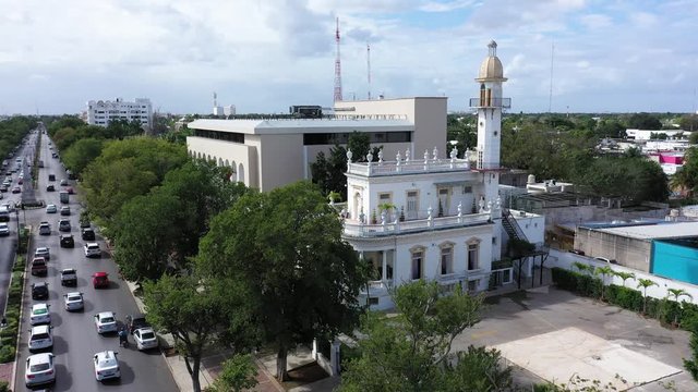 Aerial closeup push in to the el Minaret mansion on the Paseo de Montejo in Merida, Yucatan, Mexico.