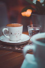 Caffee on table and blured cafe