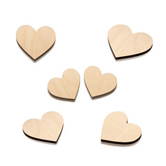 Six Wooden hearts on white