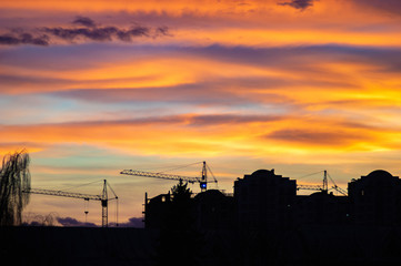 Fototapeta na wymiar Colorful sunset sky over the houses of the city