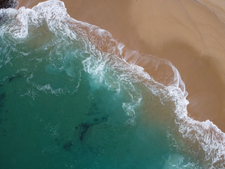Fototapeta na wymiar Waves breaking in a beach