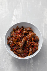 meat with vegetables in white bowl