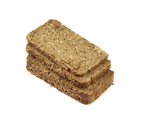 Slices of wholemeal dark bread isolated on a white background in close-up (high details)