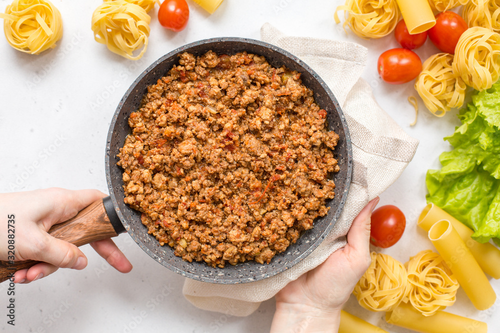 Canvas Prints Cooking a meat ragu for pasta - Bolognese sauce. Homemade, traditional recipe. Italian food.