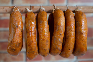 portuguese smoked sausages alheira on wooden stick
