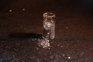 Glass bottles photographed in the studio with colored foils before the flashes