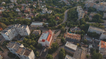 aerial city construction site near orthodox church at urban landmark