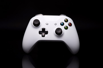 Gaming controller against black background © Andrej