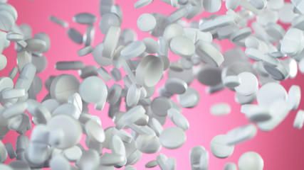 Freeze motion of flying pills on pink background