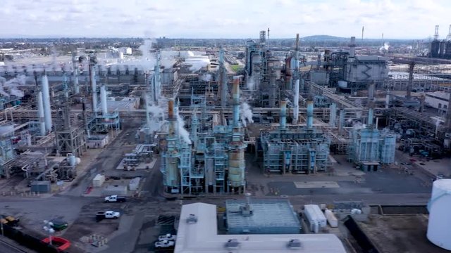 Aerial Drone Footage of Petroleum Refinery and Trucks in Industrial Area of the United States