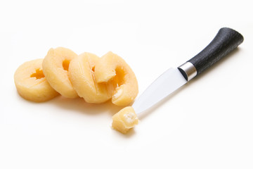 The traditional Czech round shaped smelly cheese made from curd cheese together with a knife....