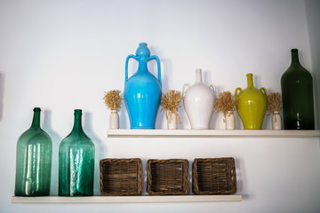 Traditional pottery of Puglia, Italy, colorful amphora for wine and big bottele for wine and olive...