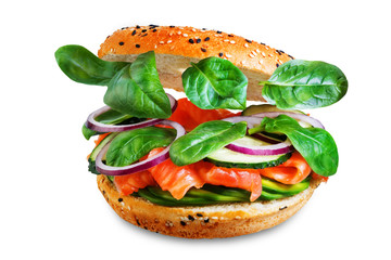 Smoked salmon spinach avocado cucumber bagel on a white isolated background