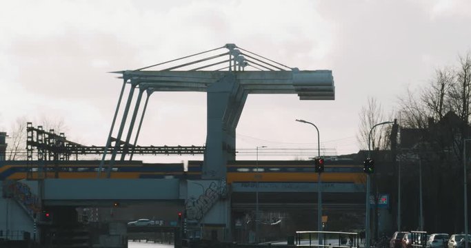 Dutch NS train passes special bridge in Amsterdam, Netherlands